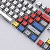 A close-up view of a set of translucent PBT keycaps with side printing in a cherry profile layout.