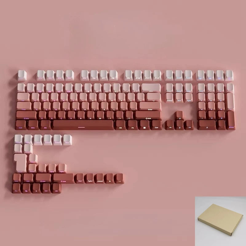 A close-up view of a gradient pink mechanical keyboard keycap set with RGB backlighting.