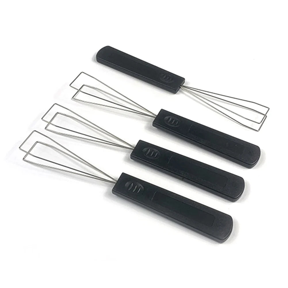 A black mechanical keyboard keycap puller with a metal switch removal tool shown against a white background.