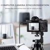 A camera is set up on a tripod next to a laptop, demonstrating computer camera synchronization.