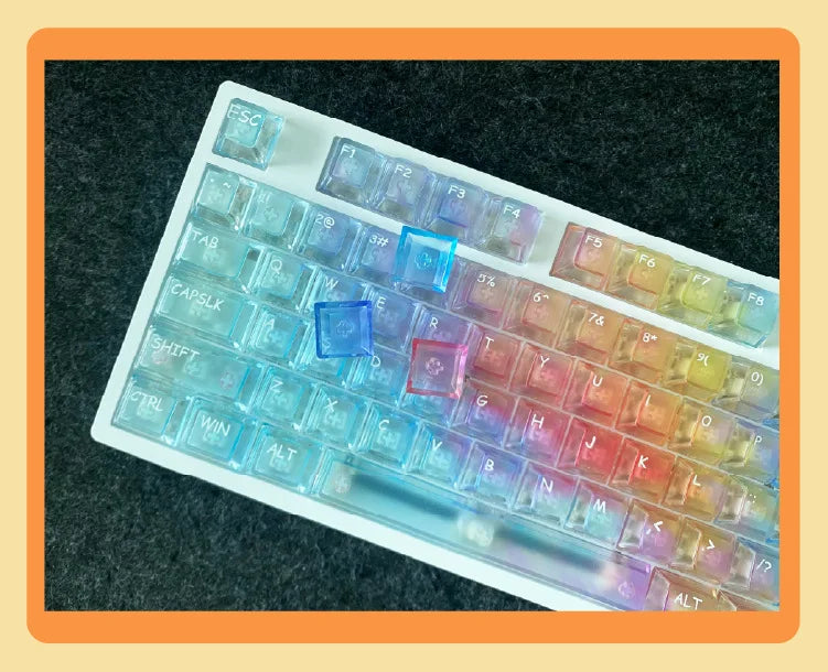 A close-up view of a white PC keycap set featuring colorful, translucent keycaps for a mechanical keyboard.