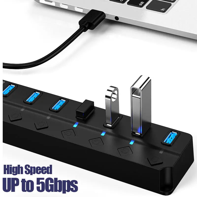 Black 7-port USB hub with individual power switches and blue LED indicators and a black cable