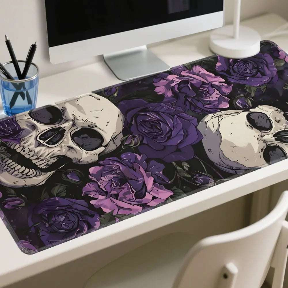 A desk mat featuring a dark floral design with skulls in purple and black tones.