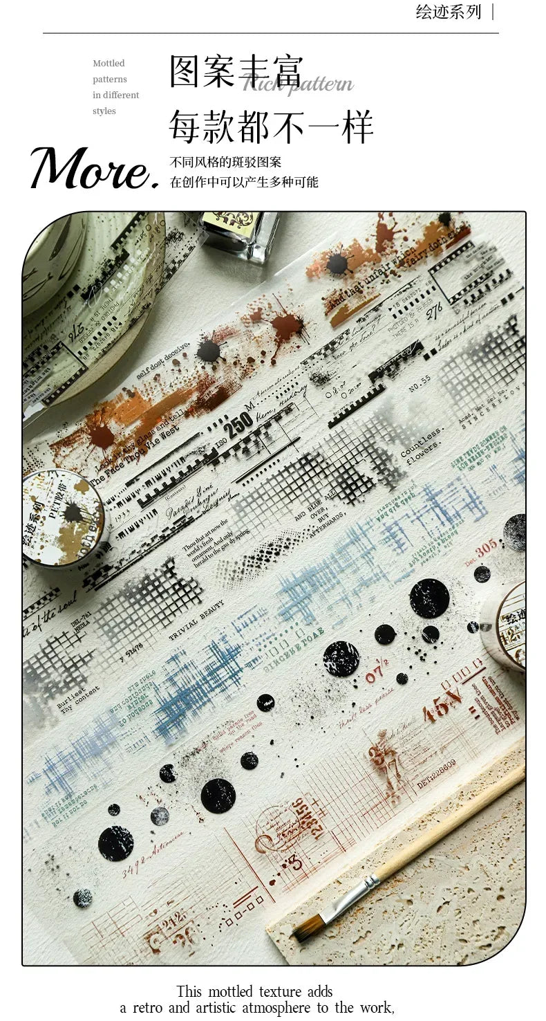 A close-up of mottled decorative PET collage tape used for crafting and labeling on a piece of paper.