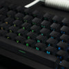 Close-up view of black PBT double-shot cherry profile keycaps on a mechanical keyboard.