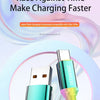 A close-up of a green USB-C charging cable with a 6A rating, shown against a light pink and purple background.