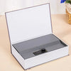 A white and gray mini secret cash storage box with an open lid displaying a silver-colored interior.