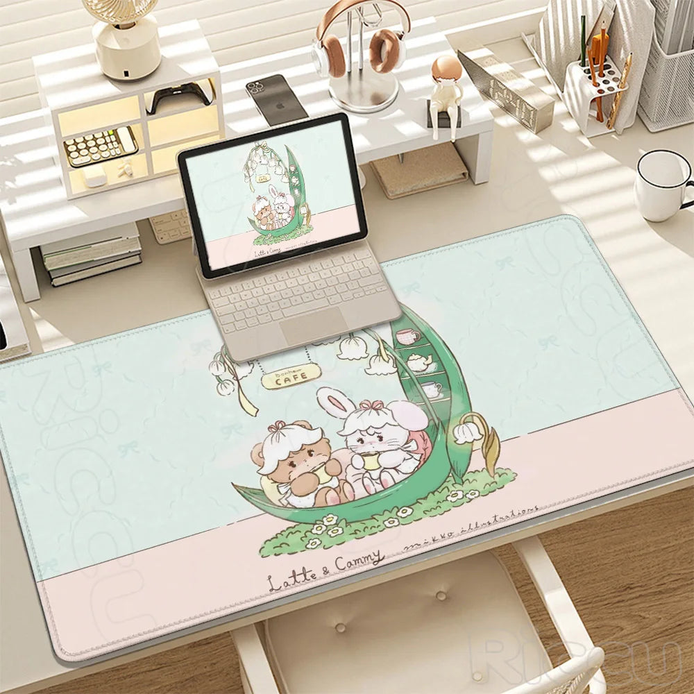 A cartoon gaming desk mat featuring cute characters and a green theme placed on a white desk.
