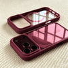 A deep magenta transparent acrylic phone case with a matching protective cover and multiple camera lenses.