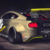 A yellow and black JDM sports car is shown from the rear, parked on a dark surface.