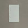 A white divider page with punched holes is shown against a neutral gray background.
