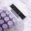 A clear plastic device with a digital display showing the number 1355.00, surrounded by purple buttons.
