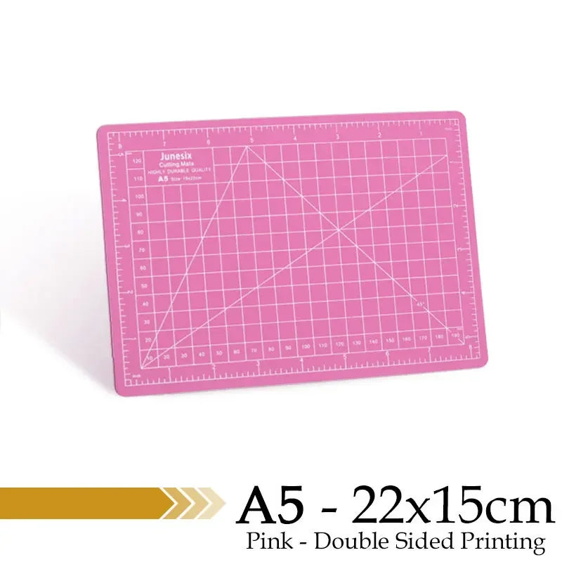 Pink A5 cutting mat with grid guides for double-sided printing
