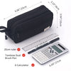 Black multi-layer stationery storage pencil case next to a ruler and a calculator