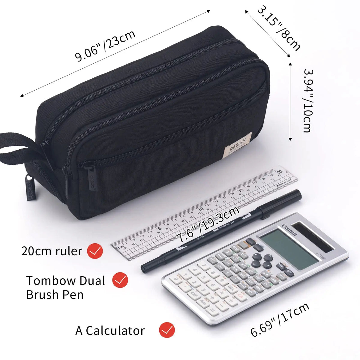 Black multi-layer stationery storage pencil case next to a ruler and a calculator