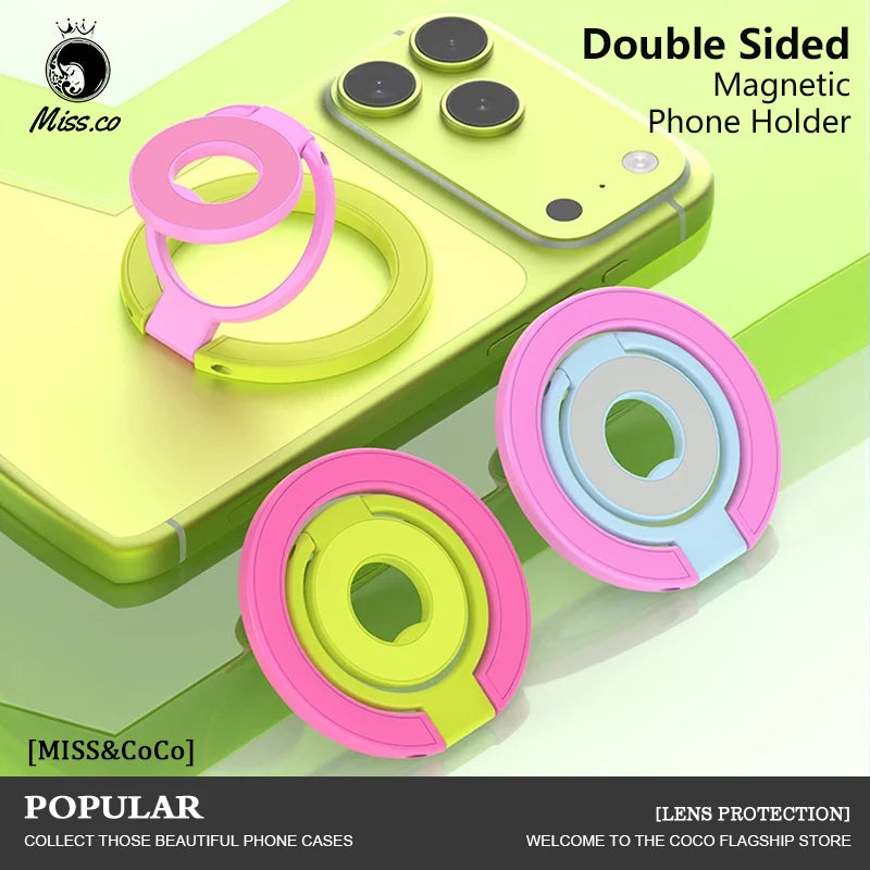 A double-sided magnetic phone holder made of pink and lime green plastic rings shown on a light green phone case.