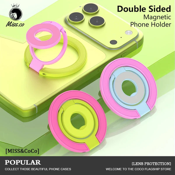 A double-sided magnetic phone holder made of pink and lime green plastic rings shown on a light green phone case.