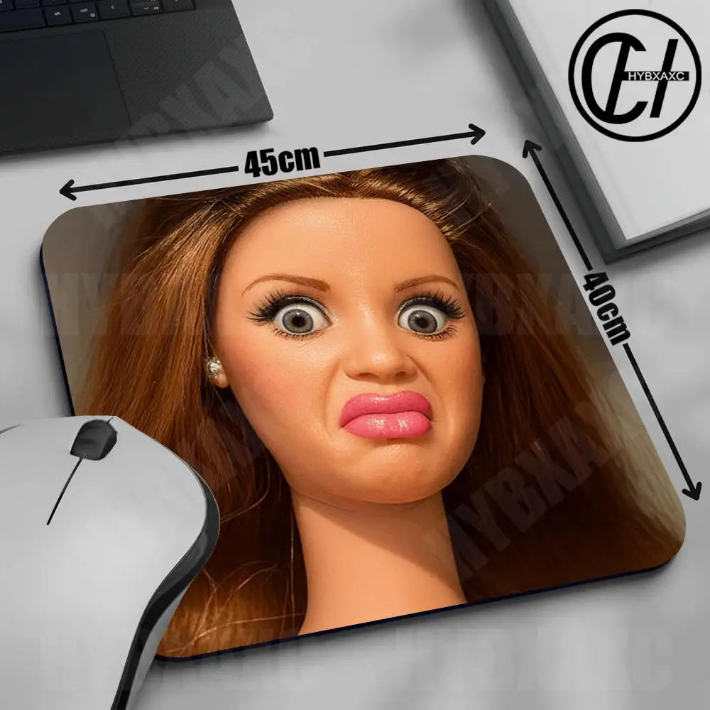 A close-up of a cute doll face mouse pad with a non-slip rubber base, showing dimensions and the product.