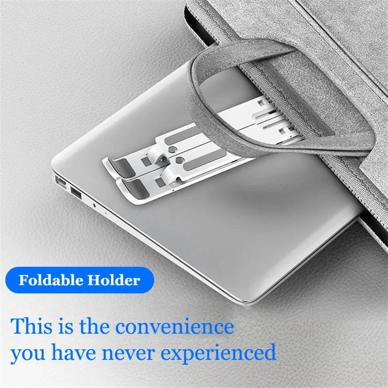 A silver laptop is shown resting in a gray fabric foldable holder designed to serve as an adjustable stand.