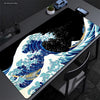 Extra-large mouse pad featuring a detailed illustration of The Great Wave of Kanagawa in blue and white.