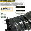 A close-up view of a black PVC fishing ruler with measurement markings and a camouflage pattern.