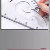 A hand is using a metal tool to trace a curved line on a clear plastic drafting ruler marked with measurements.