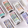 A collection of decorative transparent washi tape rolls in various colors and patterns displayed in individual boxes.