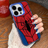 A close-up of an anime spider hero phone case with a red background and black spider design being held by a hand.
