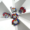 A set of five metal pins featuring cartoon anime characters with vibrant hair and facial expressions.