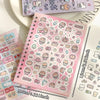 A pink sticker book filled with cute cartoon animal stickers for scrapbooking and journaling