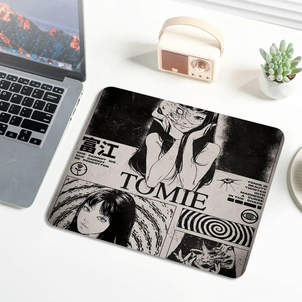 A black and white design featuring Junji Ito's Tomie with stitched edges on a mouse pad.