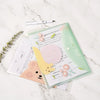 A set of four cute cartoon transparent document pouches for A4 papers displayed on a marble surface.