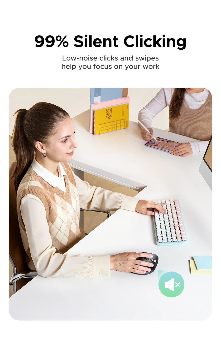 A woman uses an ergonomic vertical wireless mouse on a white desk while working.