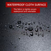 Close-up of a black cloth surface showing water droplets on a waterproof fabric.