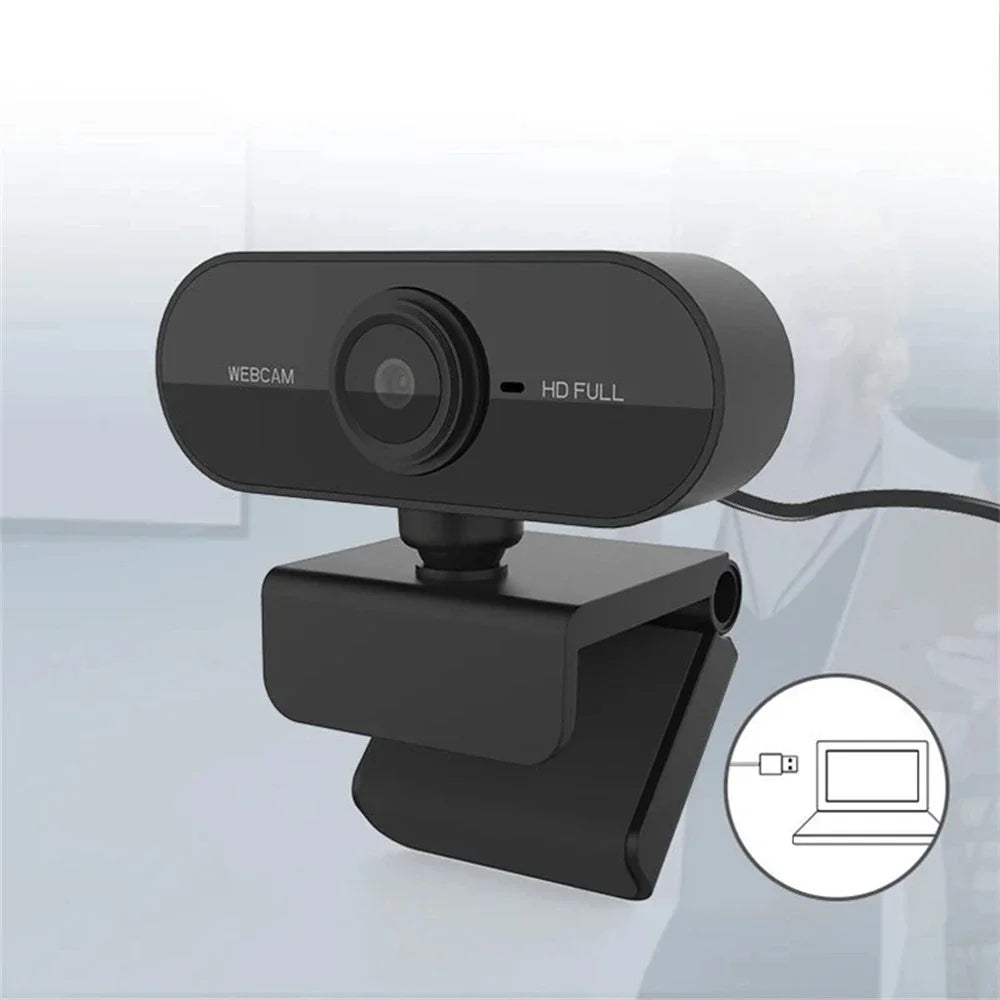 A black HD webcam is shown with a flexible cable, positioned near a laptop.