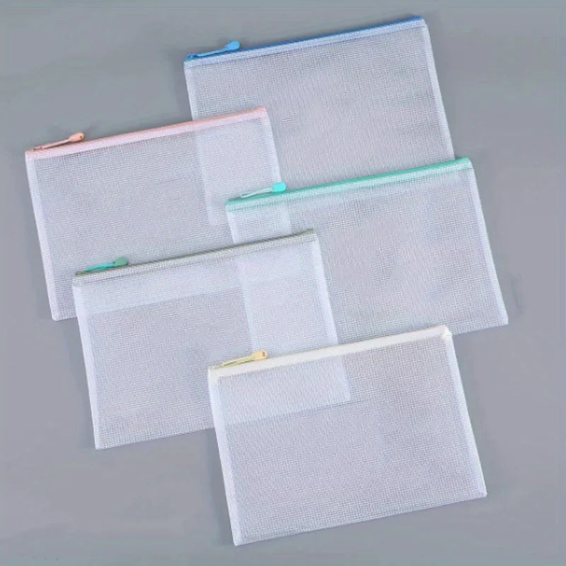 A set of clear mesh zipper bags in white and pink are displayed on a gray surface for classroom or organization use.