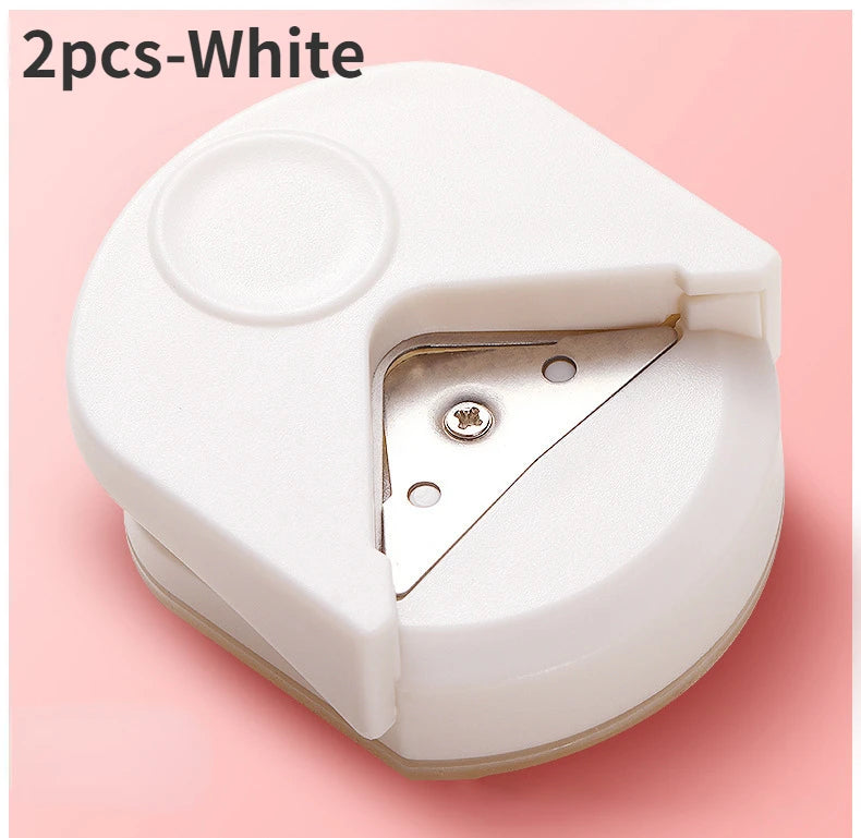 A white precision corner cutter tool is shown, opened to reveal the cutting blade.