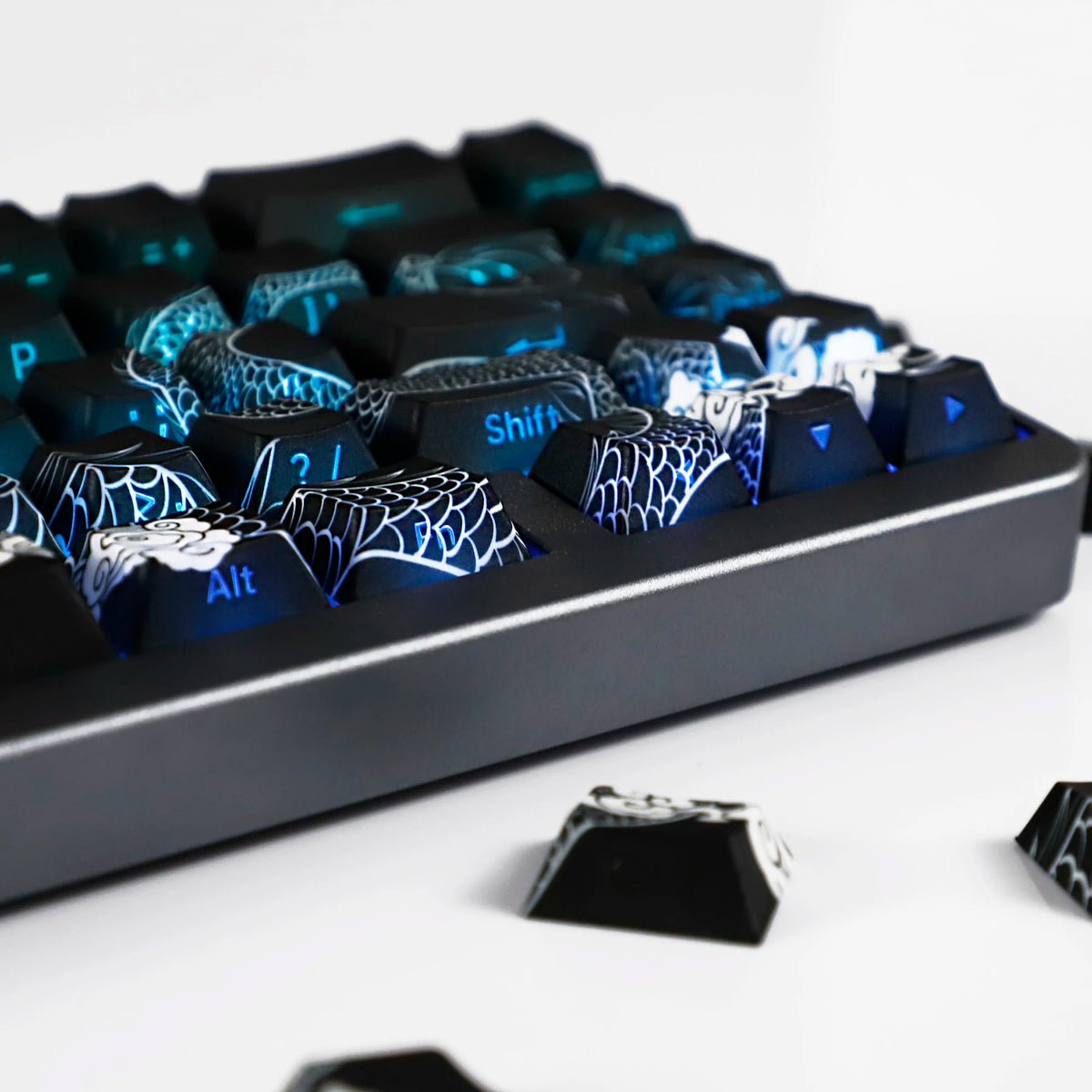 A close-up view of a black mechanical keyboard featuring blue side-lit PBT keycaps.