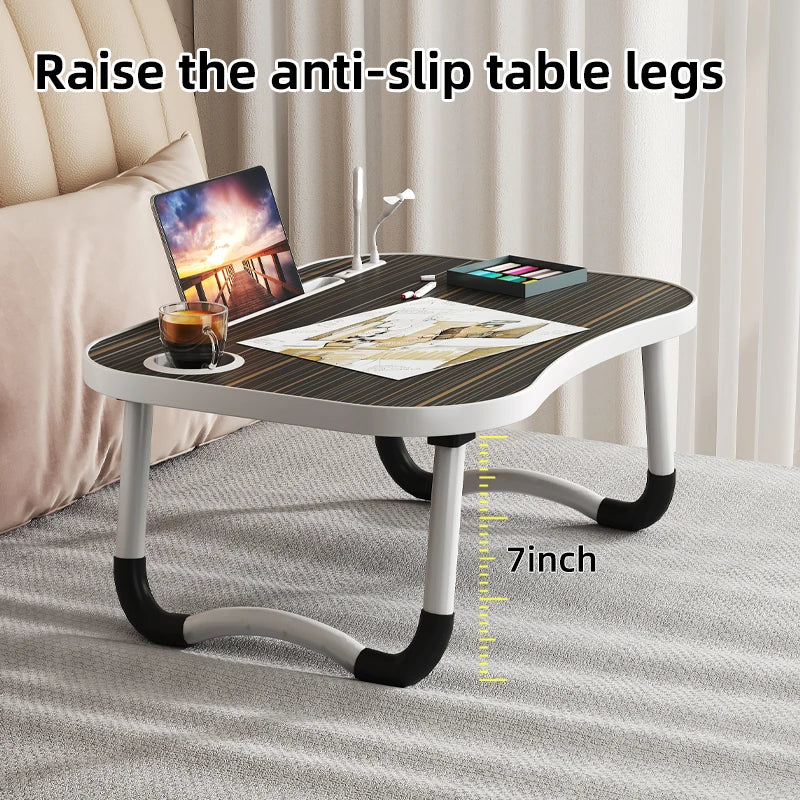 A laptop desk organizer tray with anti-slip table legs shown on a light gray surface.