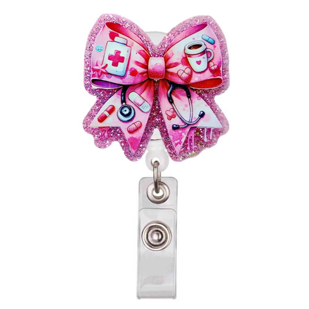 Pinker Glitzer-Acryl-Ausweisclip in Schleifenform mit medizinischen Symbolen