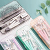 A collection of 9-piece geometry drawing tools and pens in various colors displayed on a teal background.