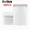 Stack of white self-sealing pearl film bubble shipping bags