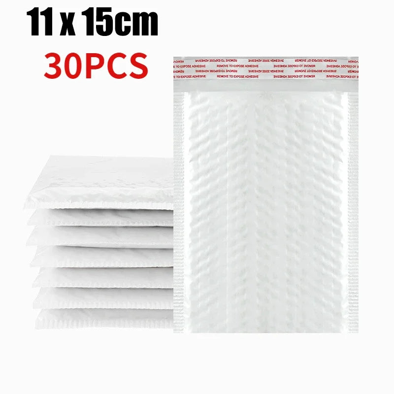 Stack of white self-sealing pearl film bubble shipping bags