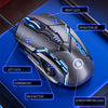 A close-up view of a dark gray wired gaming mouse with blue LED accents and various programmable buttons on a blue surface.