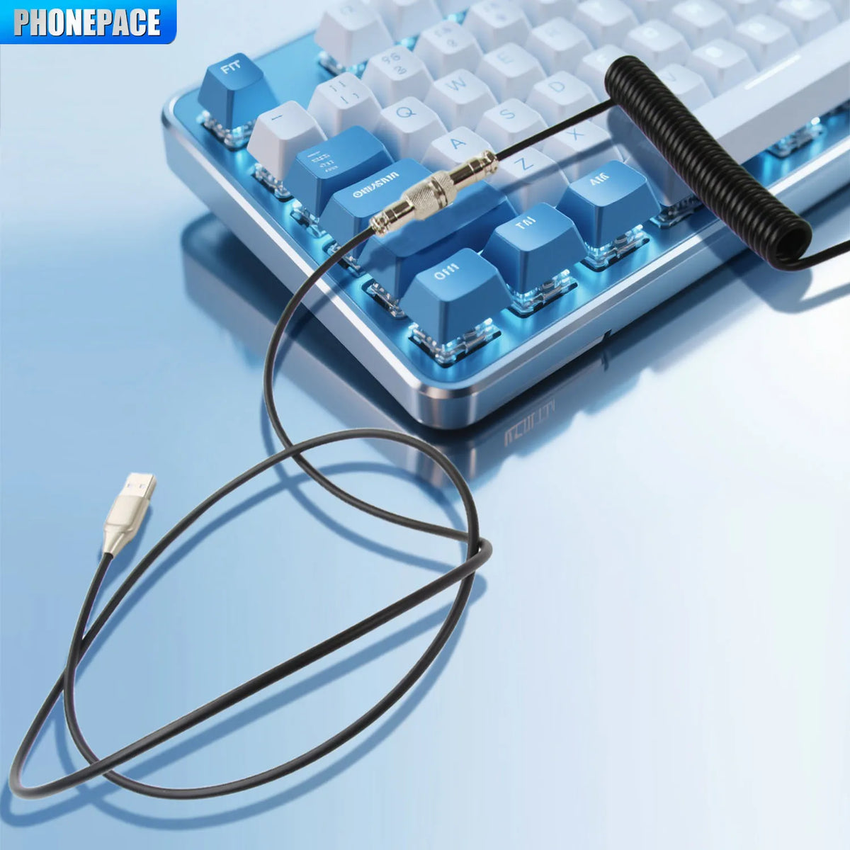 A blue mechanical keyboard with a coiled USB-C cable connected to a key switch module.