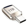 Silver flash drive with 1TB capacity and a USB Type-C connector.