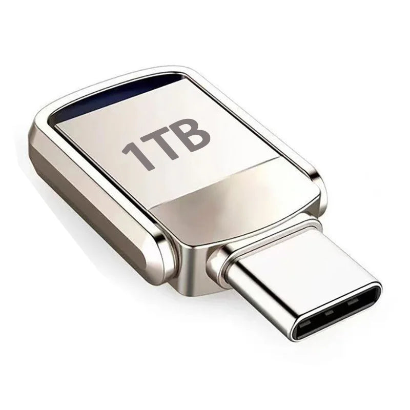 Silver flash drive with 1TB capacity and a USB Type-C connector.