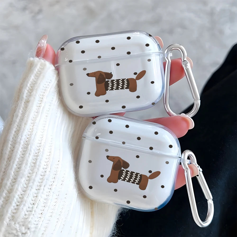 A clear silicone case with a polka dot pattern featuring a dachshund silhouette is held by a hand.