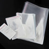 A stack of clear self-sealing plastic bags for jewelry, candy, and gifts.