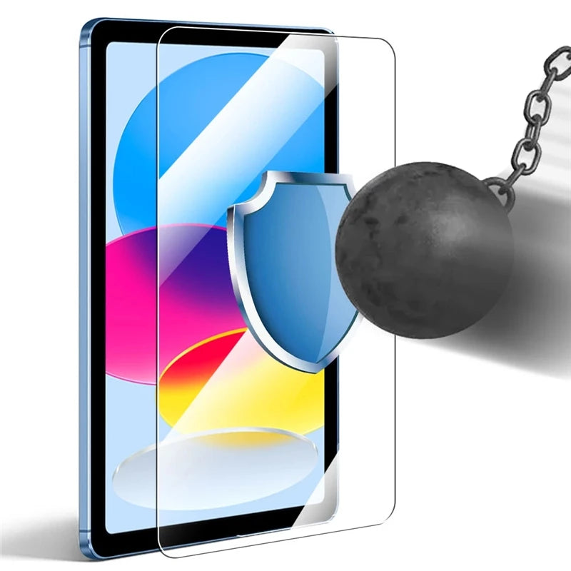 A clear glass screen protector is shown on an iPad, with a silver shield charm attached to a chain.